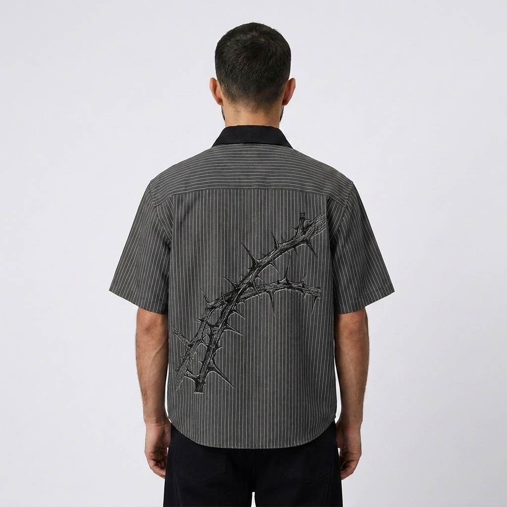 THE COST Shirt — charcoal pinstripe back, Mateo